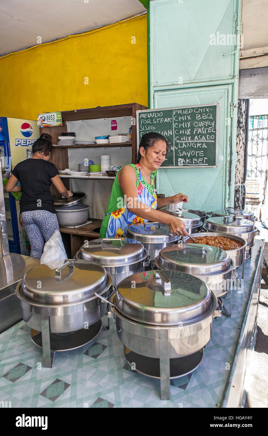 Filipino family-owned sidewalk restaurant at Barretto Town, Subic Bay, Luzon Island, Philippines. Stock Photo
