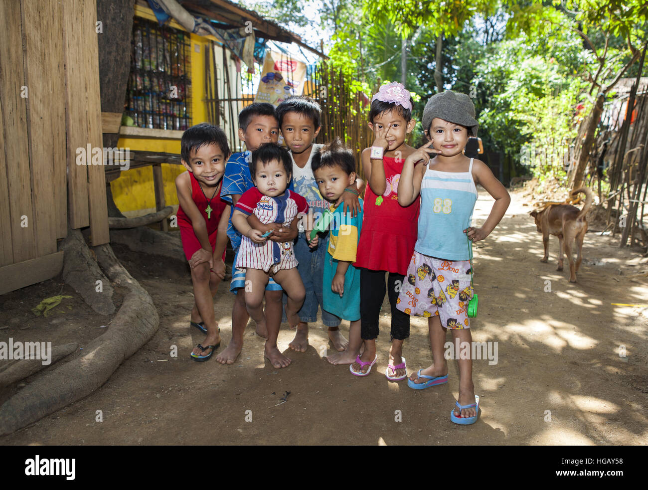 Portrait of a group of children who are neighborhood playmates in the Philippines. Stock Photo