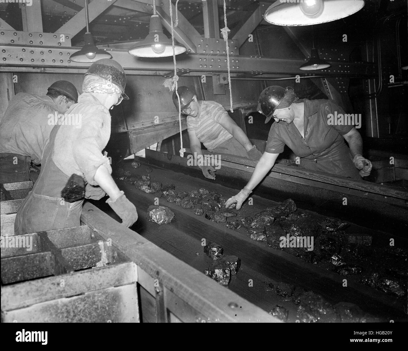 Women pick foreign matter out of coal, Rock Springs, Wyoming, 1946. Stock Photo