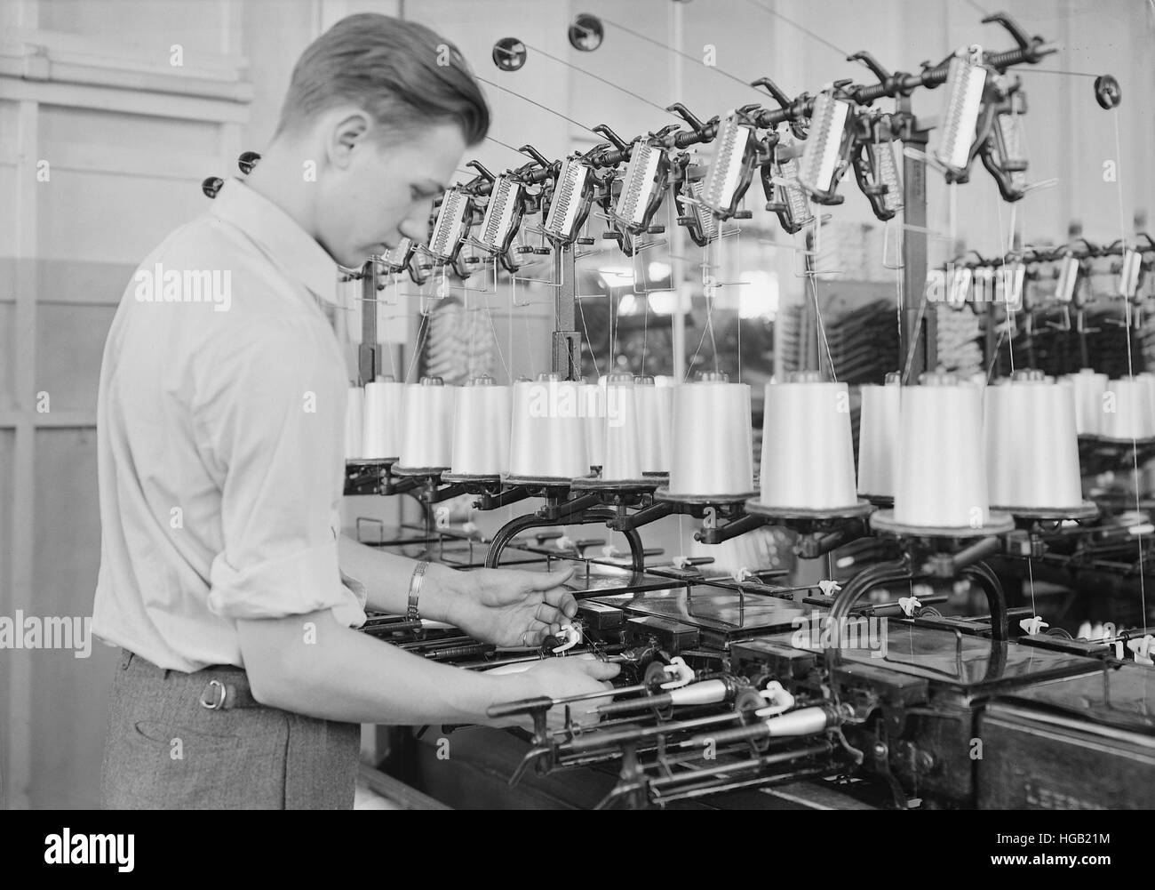 Man quilling rayon at the William Skinner and Sons Silk Mill, 1936 Stock Photo Alamy