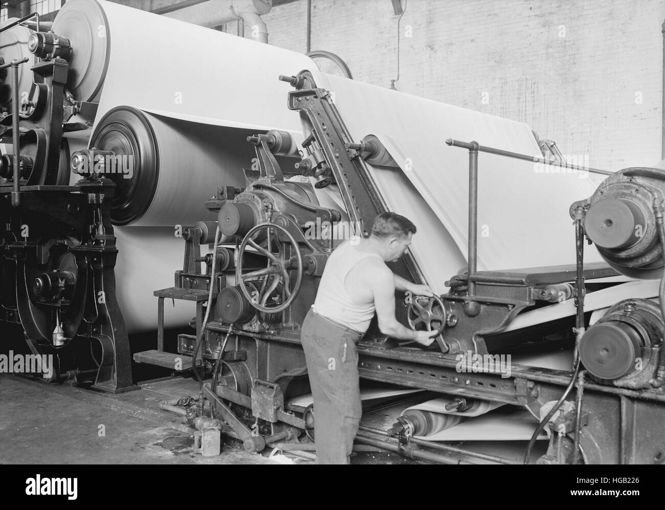 Worker making matchboard on cylinder machines, 1936. Stock Photo