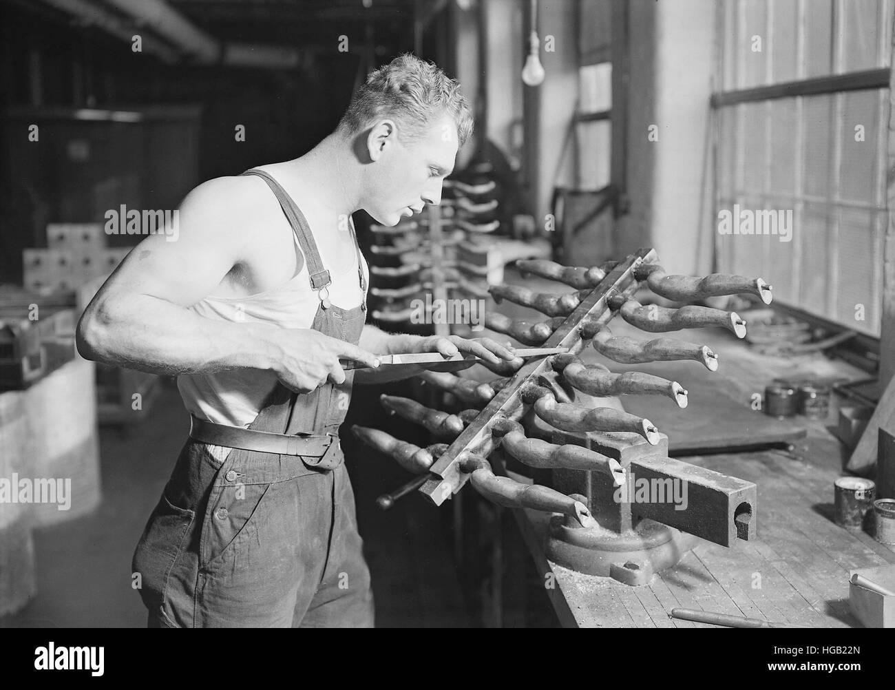 Worker building rubber doll molds, 1936 Stock Photo - Alamy