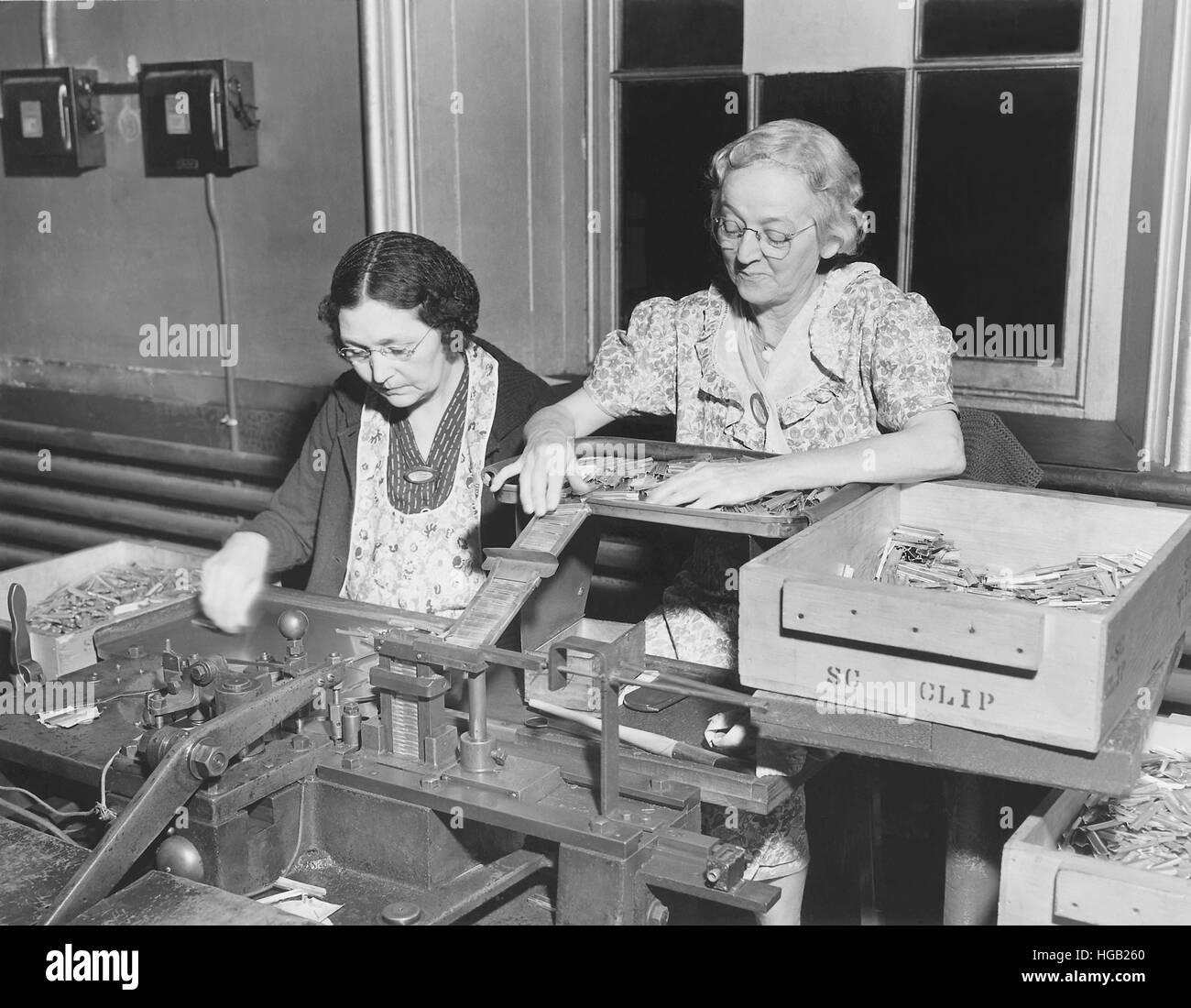 Women assembling .30 caliber cartridges at the Frankford Arsenal in Pennsylvania. Stock Photo