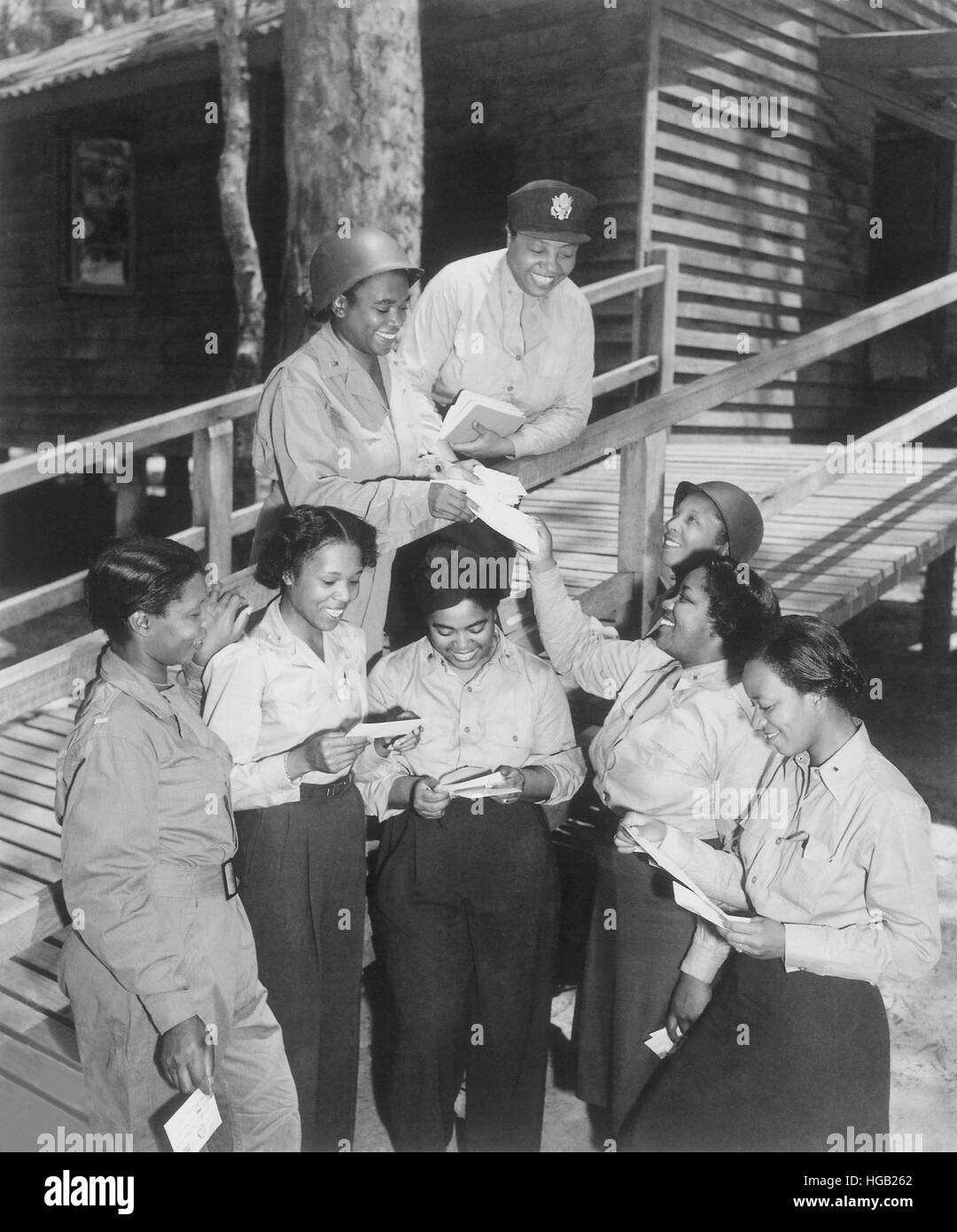 A group of nurses receiving their first batch of mail from home while in Australia in 1943. Stock Photo