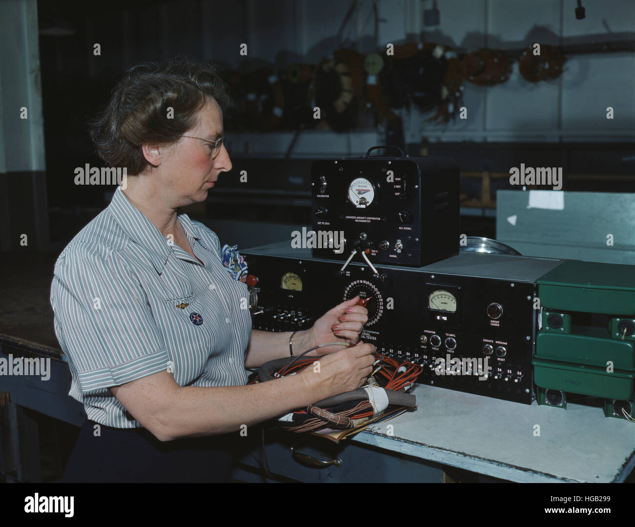 Woman working with the electric wiring at Douglas Aircraft Company, 1942. Stock Photo