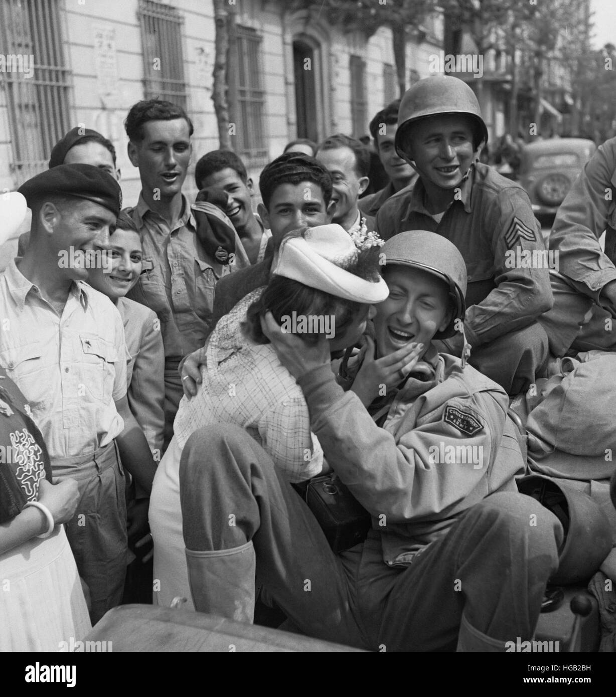 U.S. Army soldier is welcomed with a kiss by a young lady in Porto Farina, Tunisia, 1943. Stock Photo