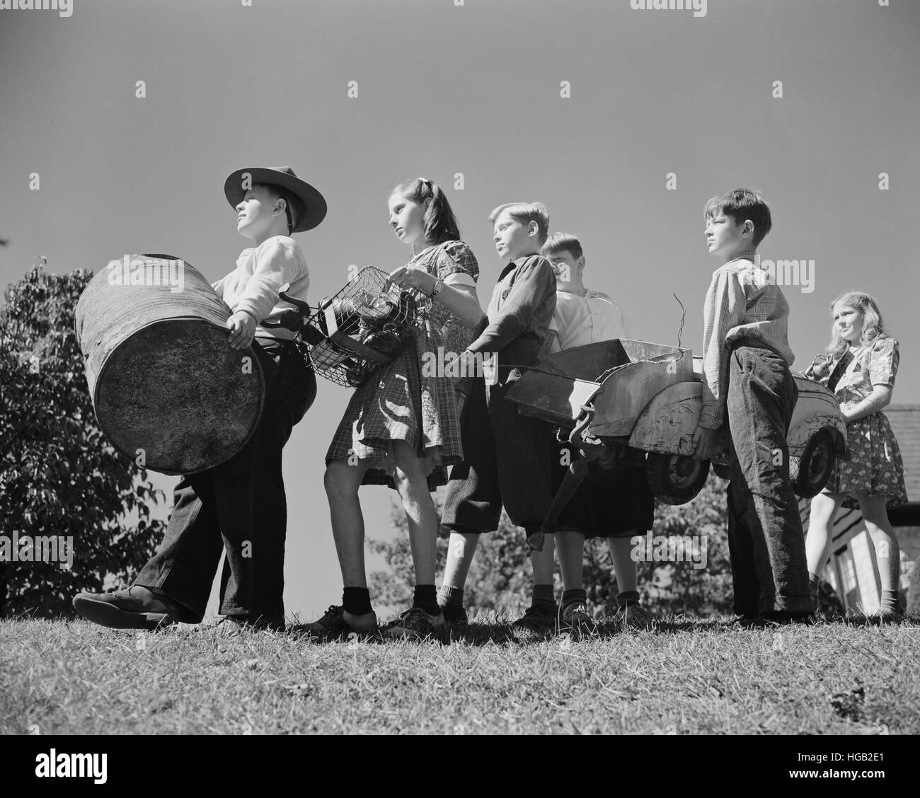 Young children collect scrap to donate for our war industries, 1942. Stock Photo