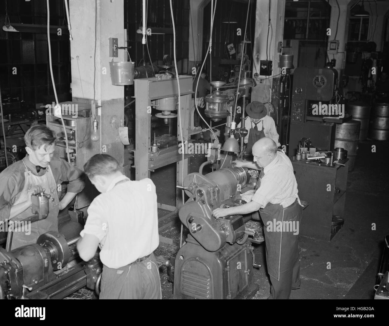 Workers using lathes in the tool room of the Warren McArthur plant, 1942. Stock Photo