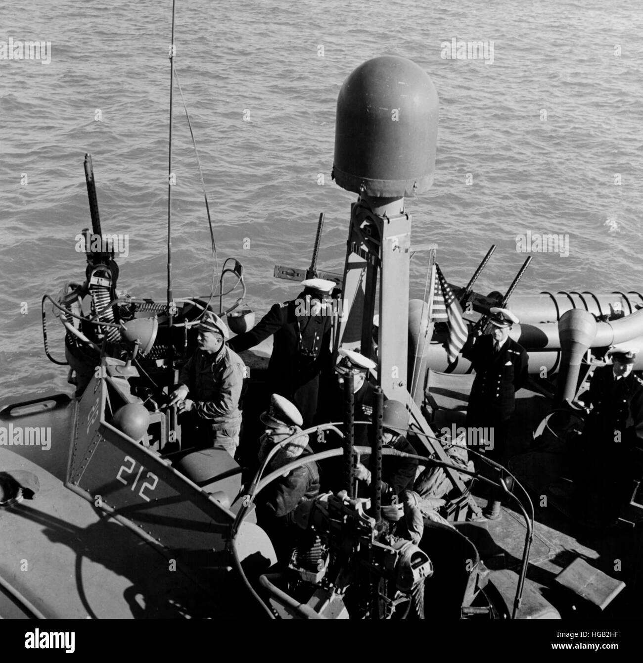 USS PT-212 with several British officers on board during World War II Stock Photo