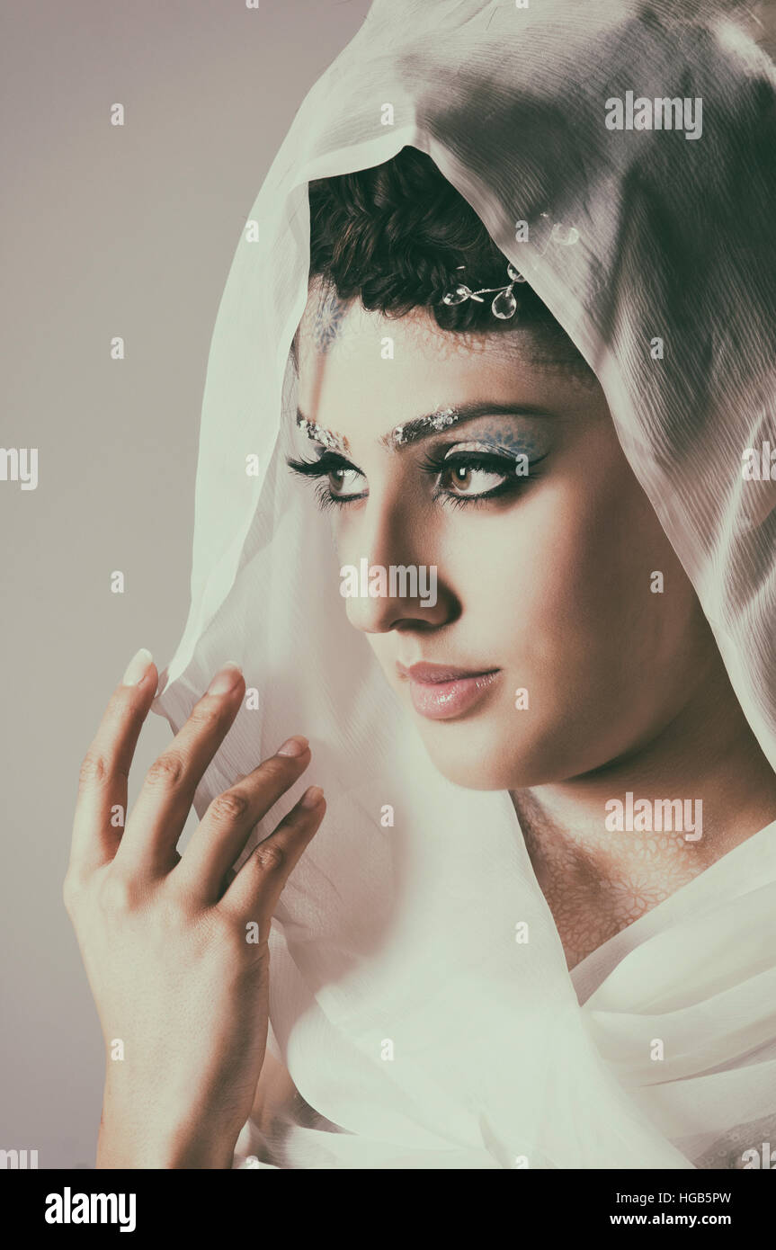 Woman wearing a headscarf looking away Stock Photo