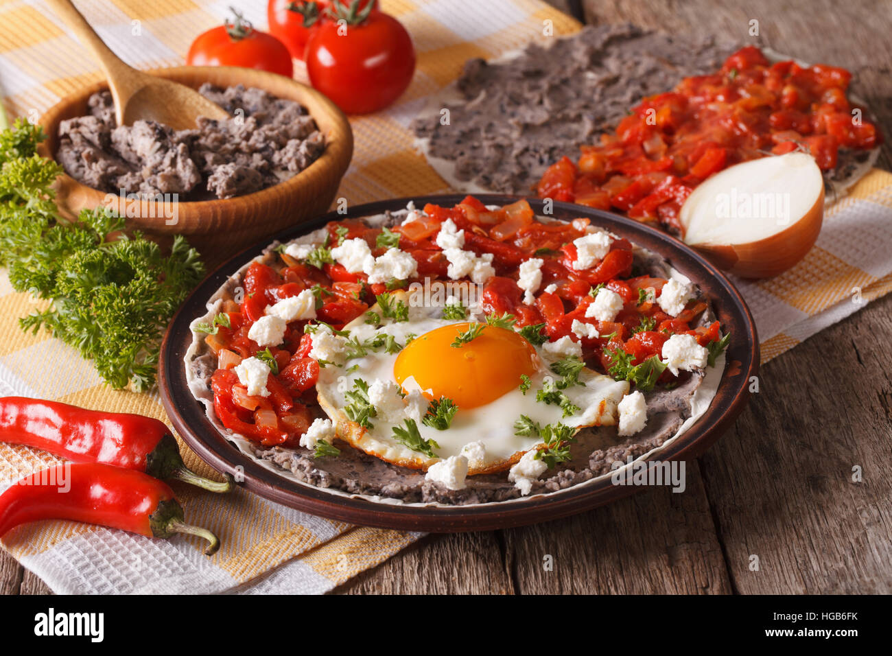 Mexican breakfast: huevos rancheros close-up on a plate on the table. horizontal Stock Photo