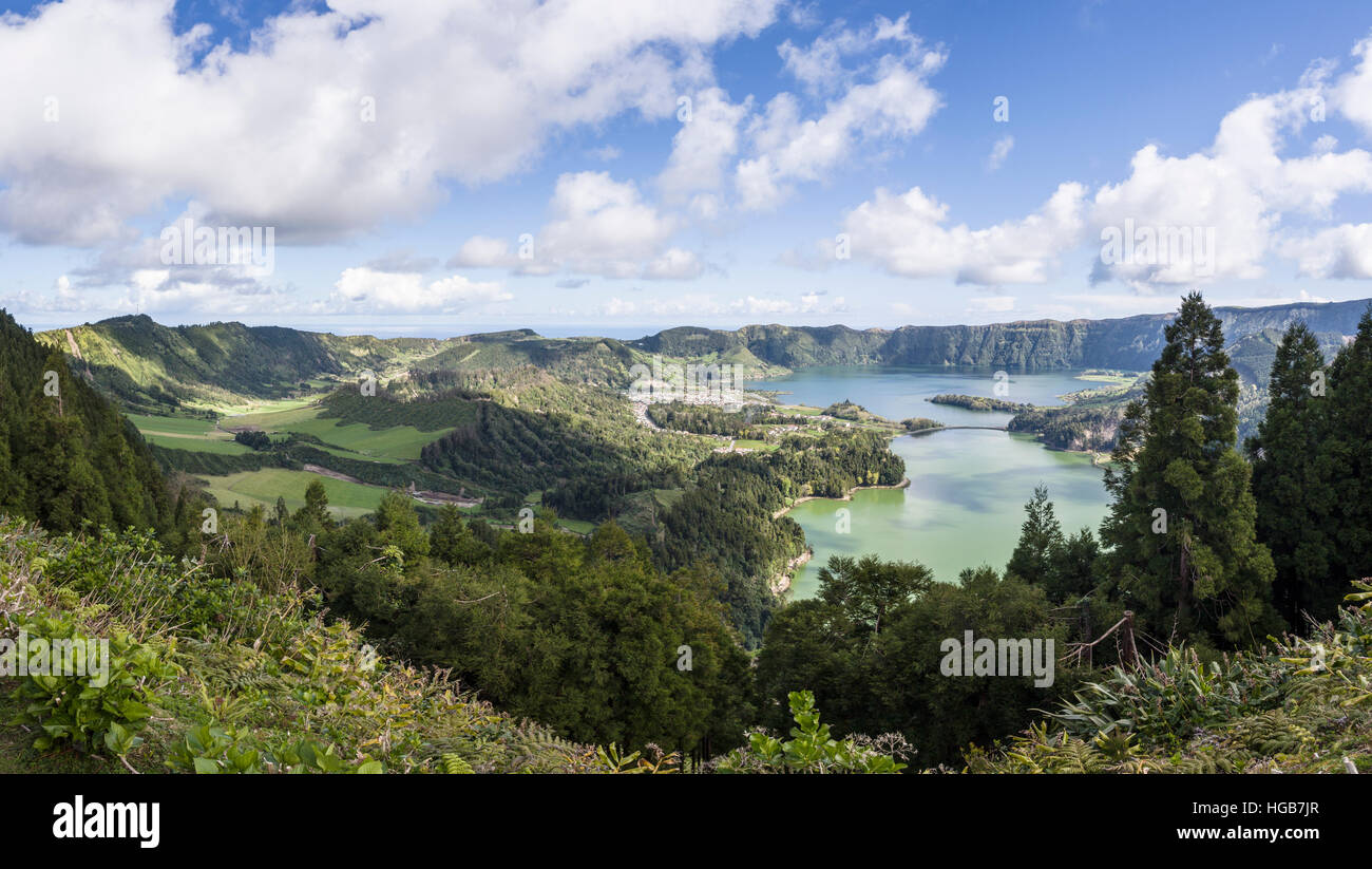 Sete Cidades Lakes Caldeiras and Valley. A panorama of the town of Sete Cidades, Lagoa Azul, Lagoa Verde and the valley behind. Stock Photo