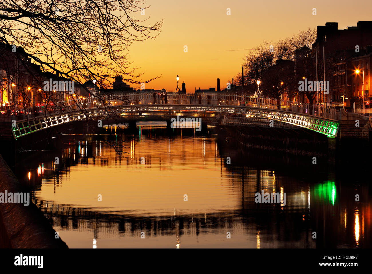 Ha'penny Bridge and the north banks of the river Liffey in Dublin City ...