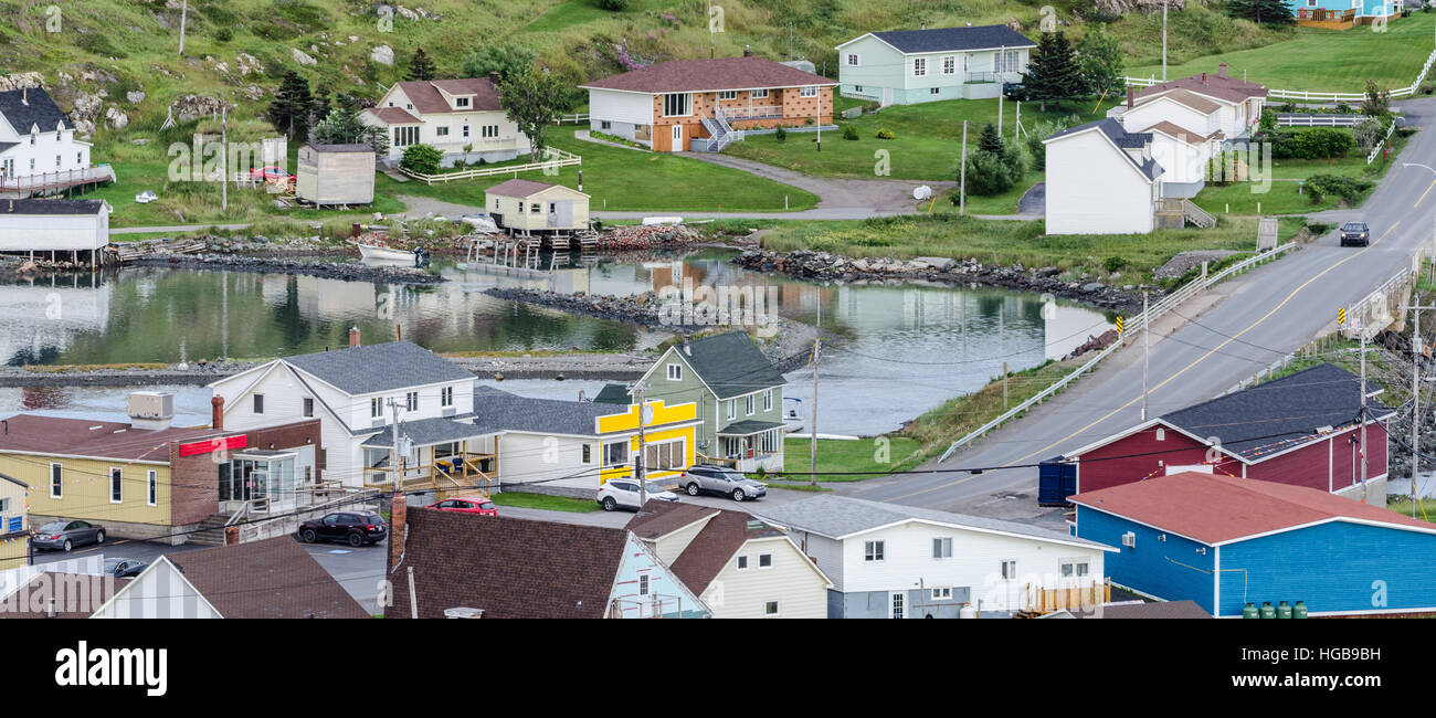 Small village community, Twillingate, Newfoundland.  Fishing boats docked along the shoreline in this coastal town. Stock Photo
