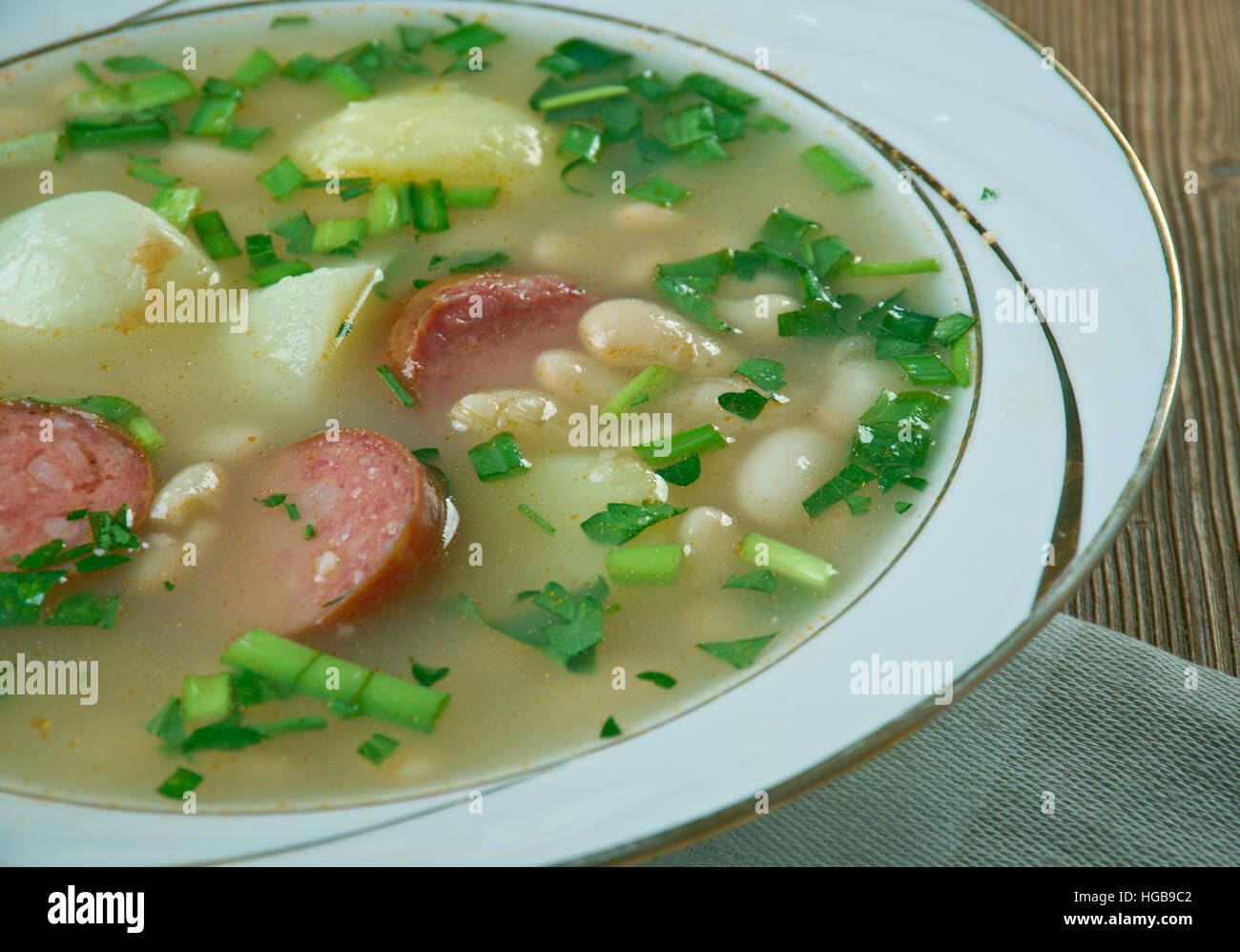 Slow Cooker Sausage, Spinach and White Bean Soup.close up Stock Photo