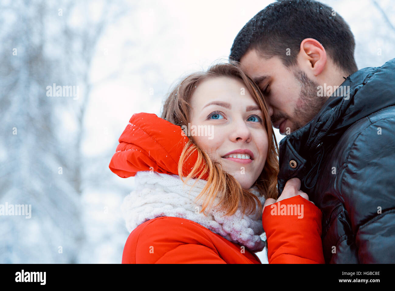 Young couple resting in park, embrace and smilling of loving Stock Photo