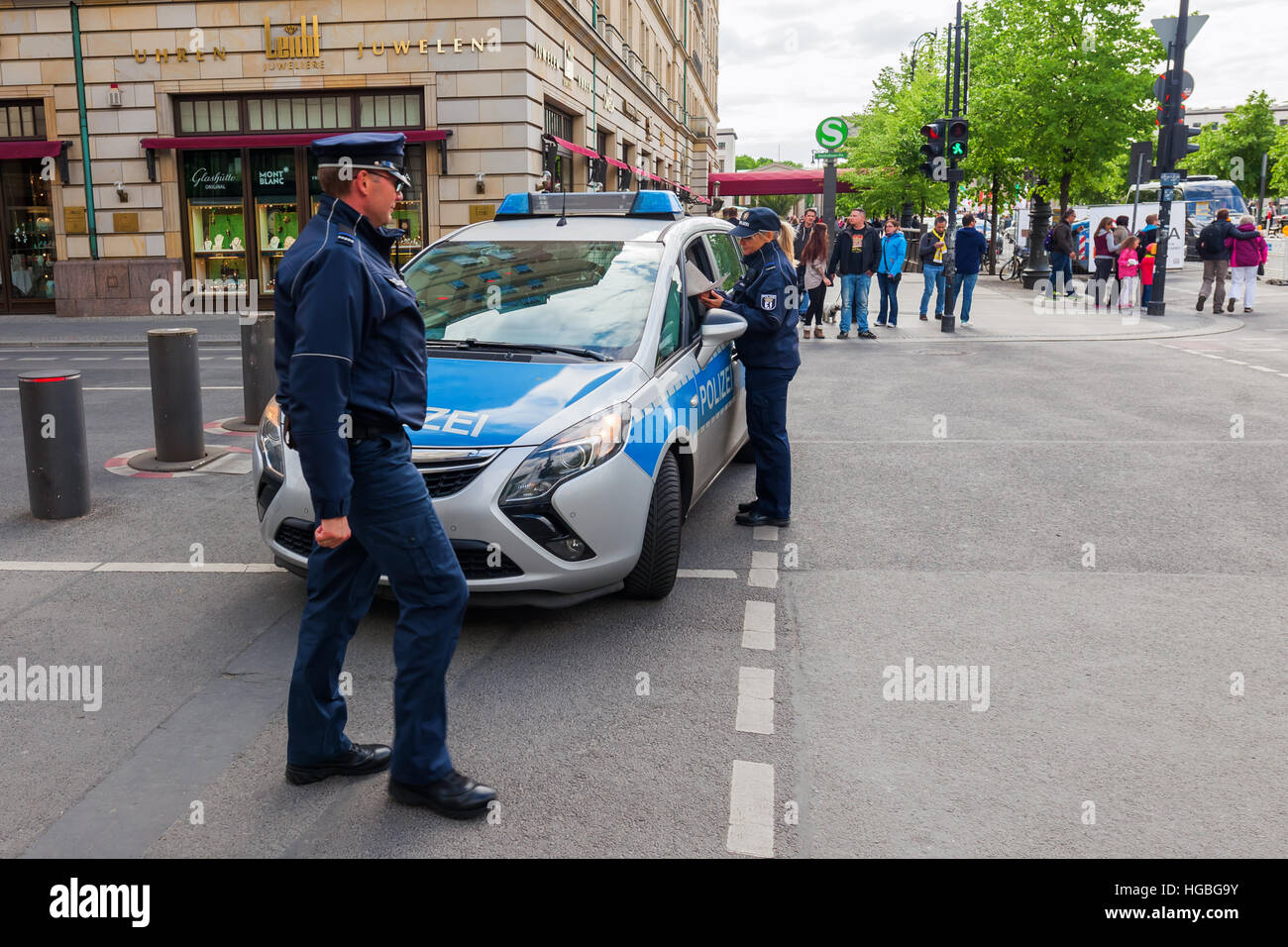 Berlin, Germany - May 14, 2016: police car in Berlin with unidentified people. Berlin, capital of Germany, has about 3.5 mio inhabitants and is a glob Stock Photo