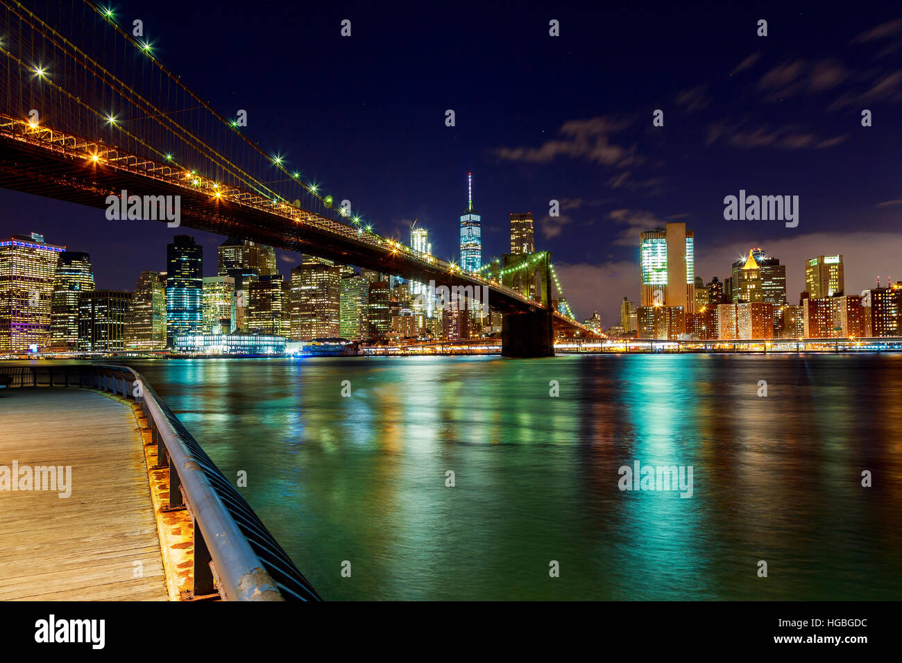 Brooklyn Bridge over East River at night in New York City Stock Photo ...