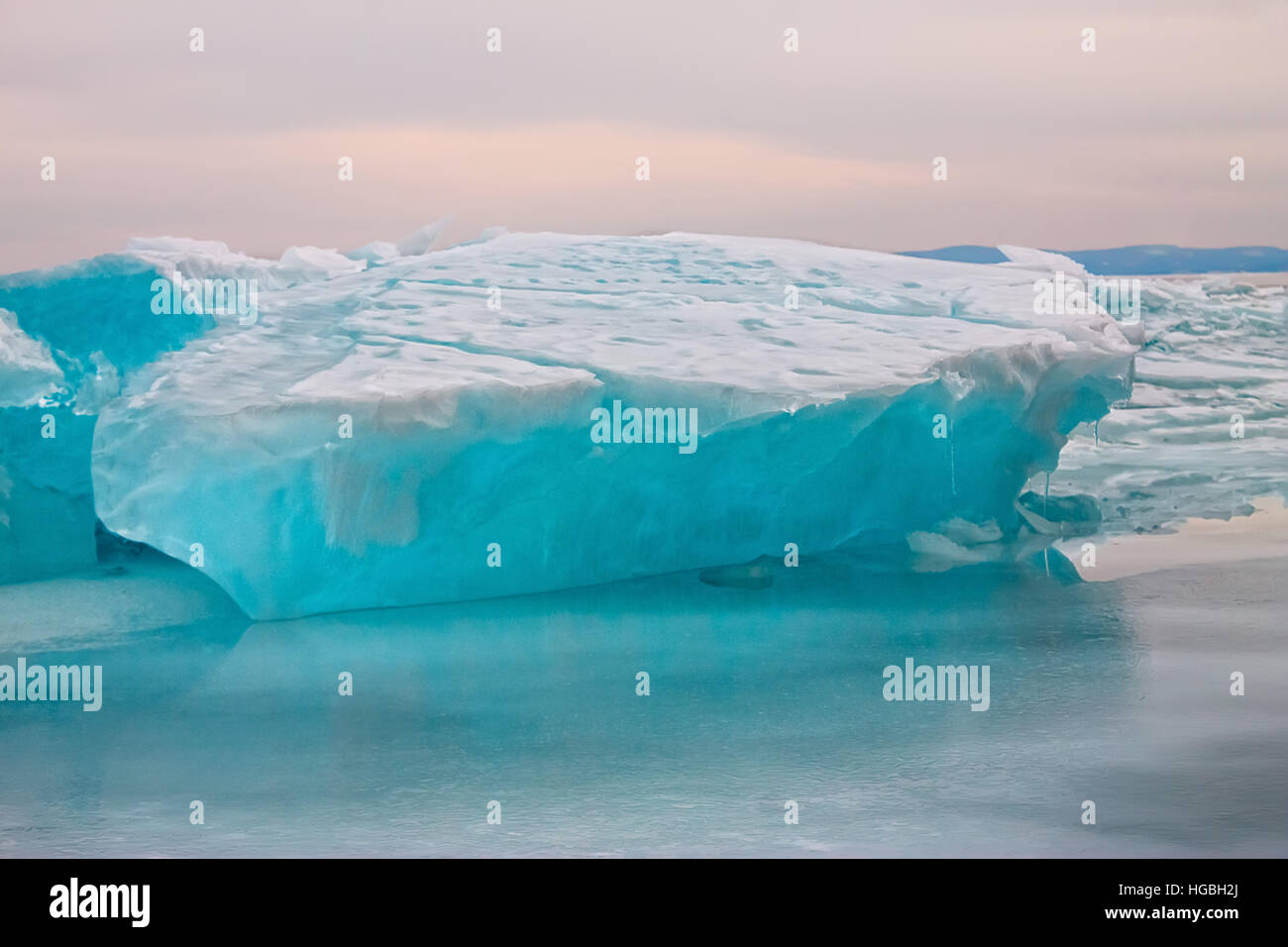 Arctic blue glacier ice hummock in cloudy weather Stock Photo - Alamy