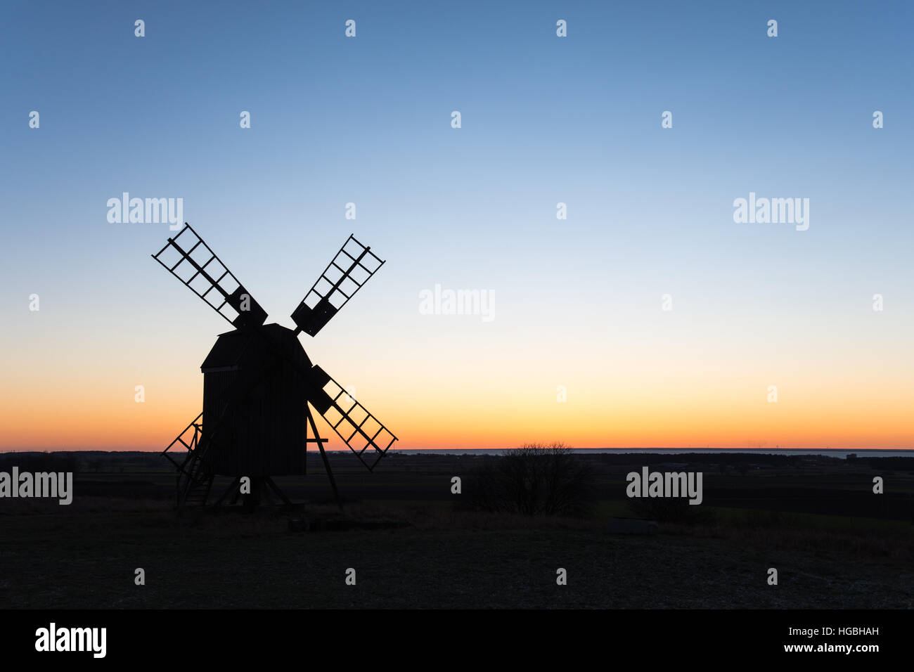 Old traditional windmill silhouette at the swedish island Oland in the Baltic Sea Stock Photo