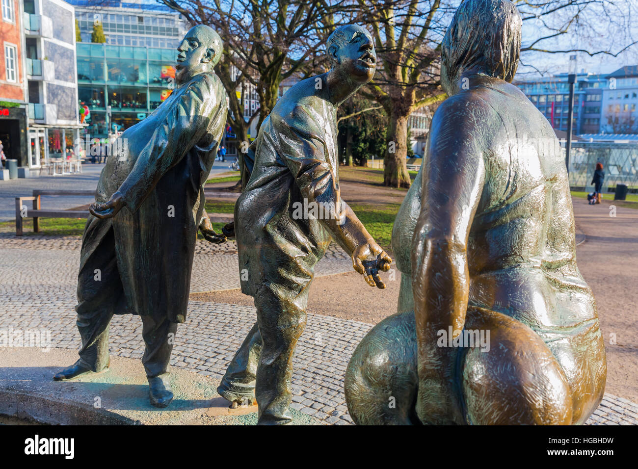 Aachen, Germany - December 27, 2016: bronze statue named circulation of money in Aachen, with unidentified people. Aachen is a spa town in NRW and was Stock Photo