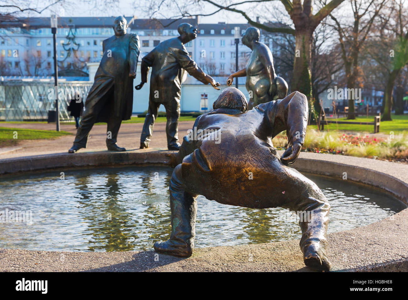 Aachen, Germany - December 27, 2016: bronze statue named circulation of money in Aachen, with unidentified people. Aachen is a spa town in NRW and was Stock Photo