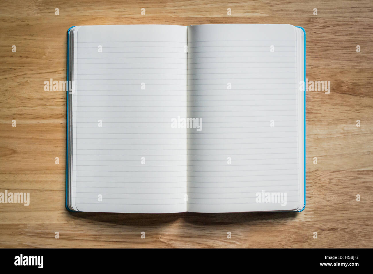 Blank Notebook on Wooden Table Stock Photo