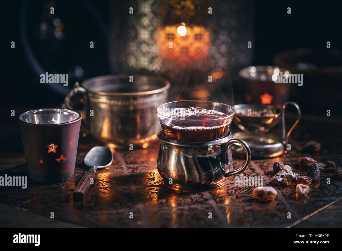 Hot tea with candle in cold winter evening Stock Photo - Alamy