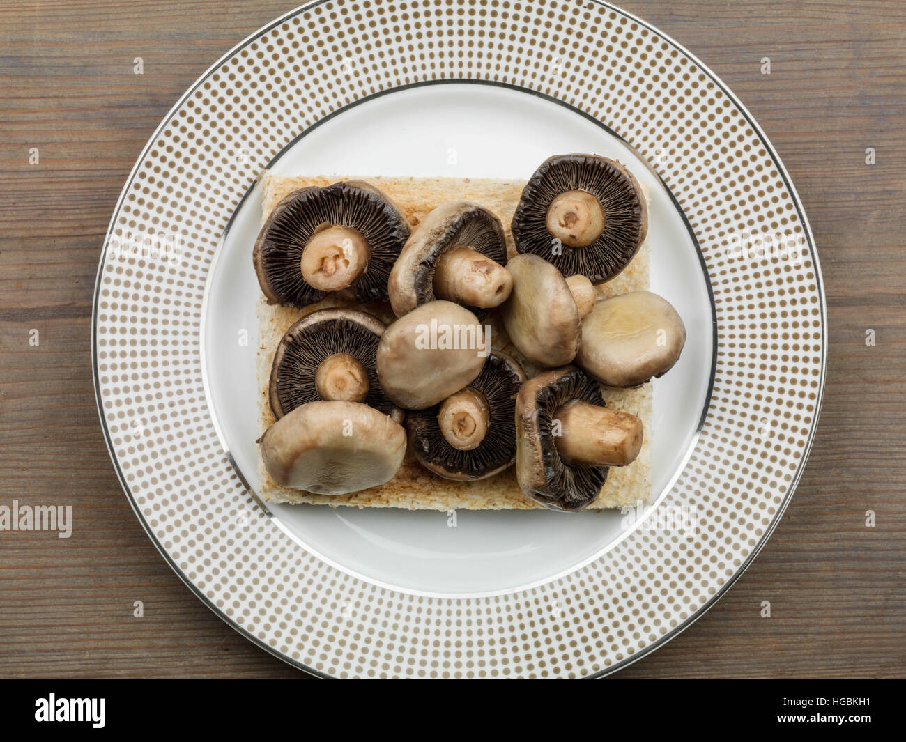 Healthy Breakfast Or Snack Of Freshly Cooked Mushrooms On Toast Served On A Plate As Calorie Controlled Diet With No People As A Flat Lay Composition Stock Photo