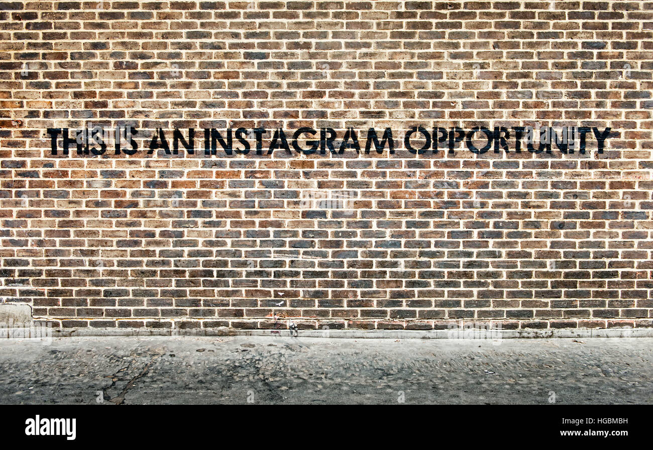 Ironic wallart of empty wall encouraging instagram photography Stock