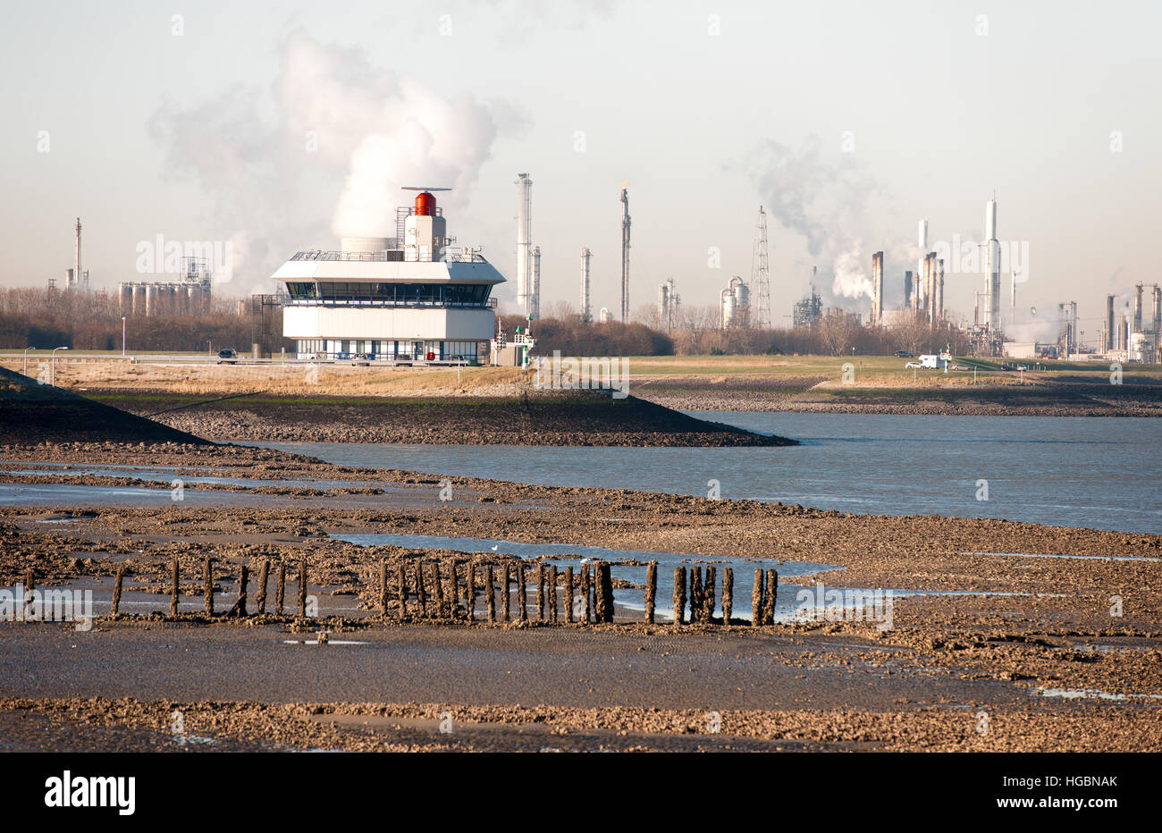 View of the banks of the Westerschelde near Terneuzen in the background is the Traffic Station and part of Dow chemical visible Stock Photo