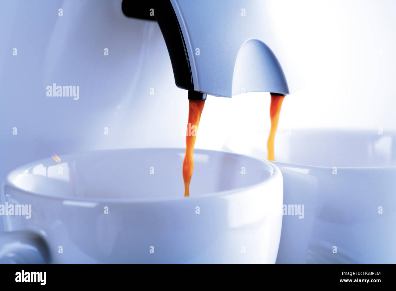 Espresso machine, coffee pouring into two cups Stock Photo - Alamy