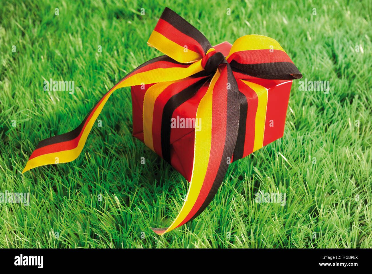 Red gift with ribbon: German national colours Stock Photo