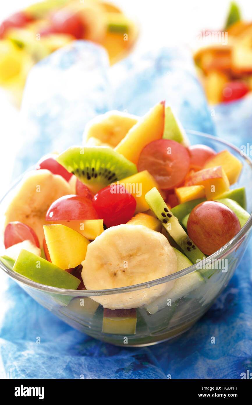 Fruit salad kiwis, grapes, bananas, apples, mango and peaches Stock