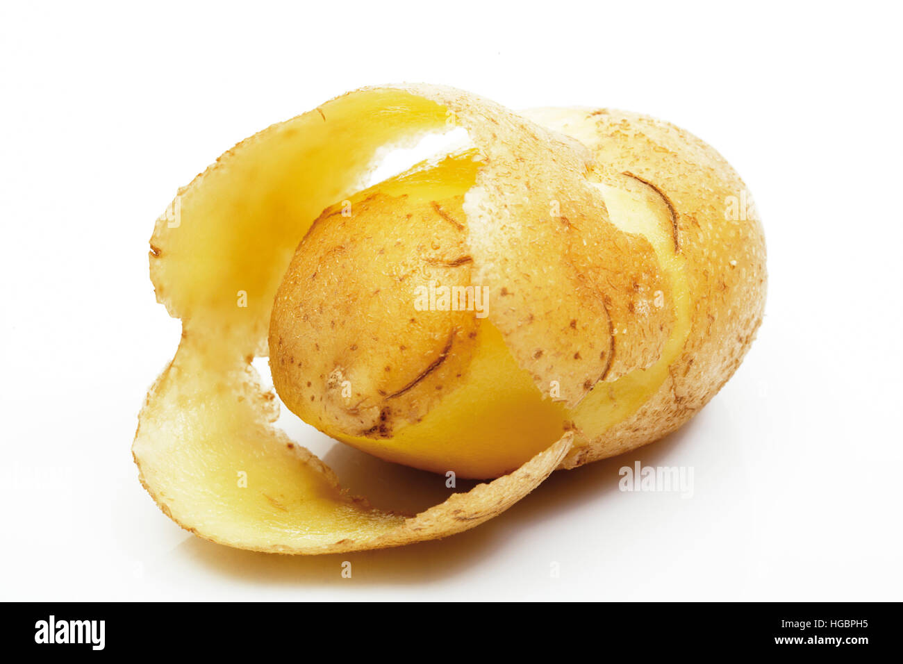Raw, halfpeeled potato Stock Photo Alamy