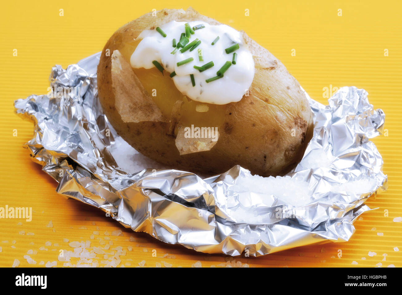 Baked potato with yogurt dip and chives Stock Photo Alamy