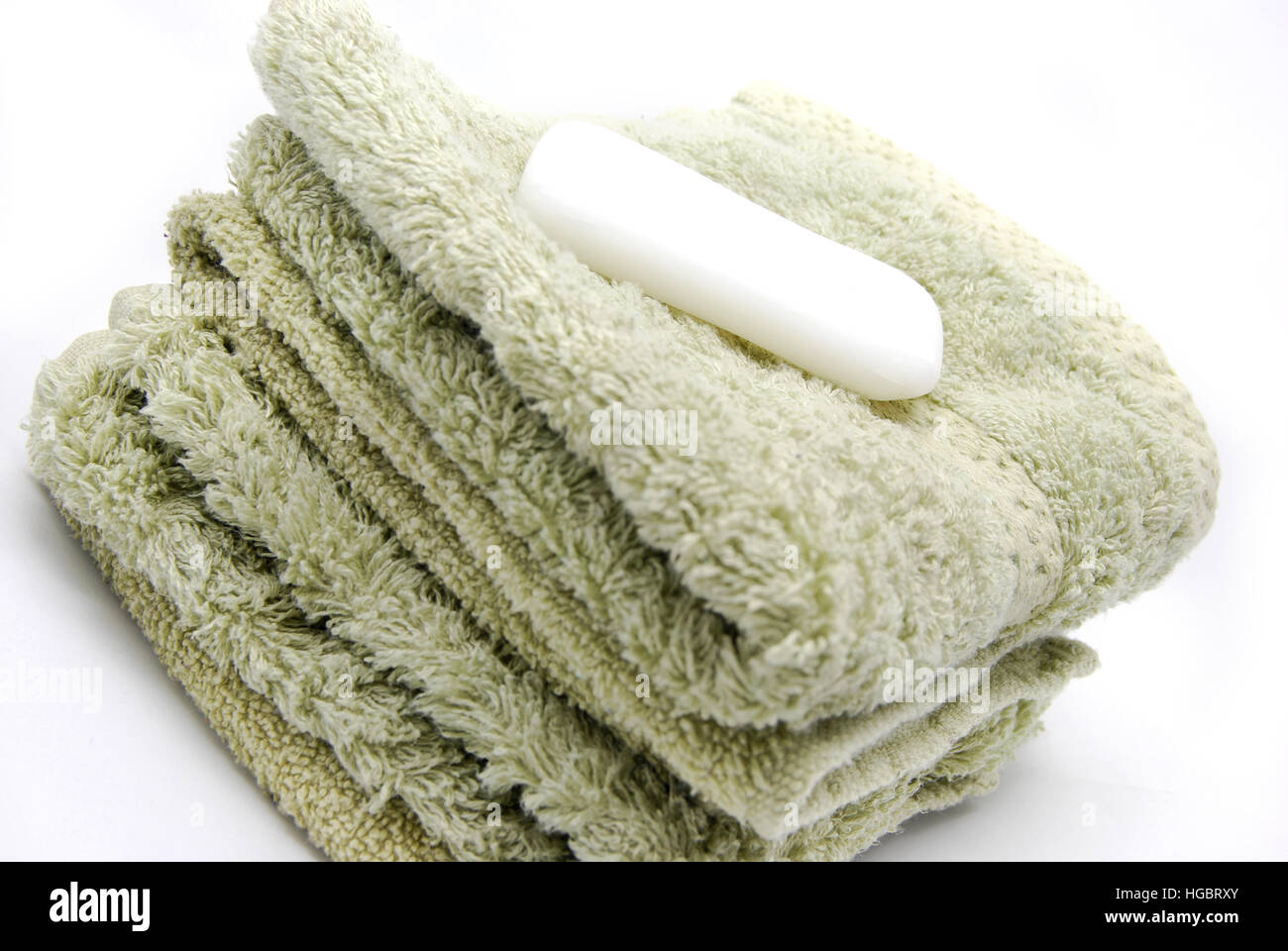 Hand or face towels with a bar of soap for washing. Stock Photo
