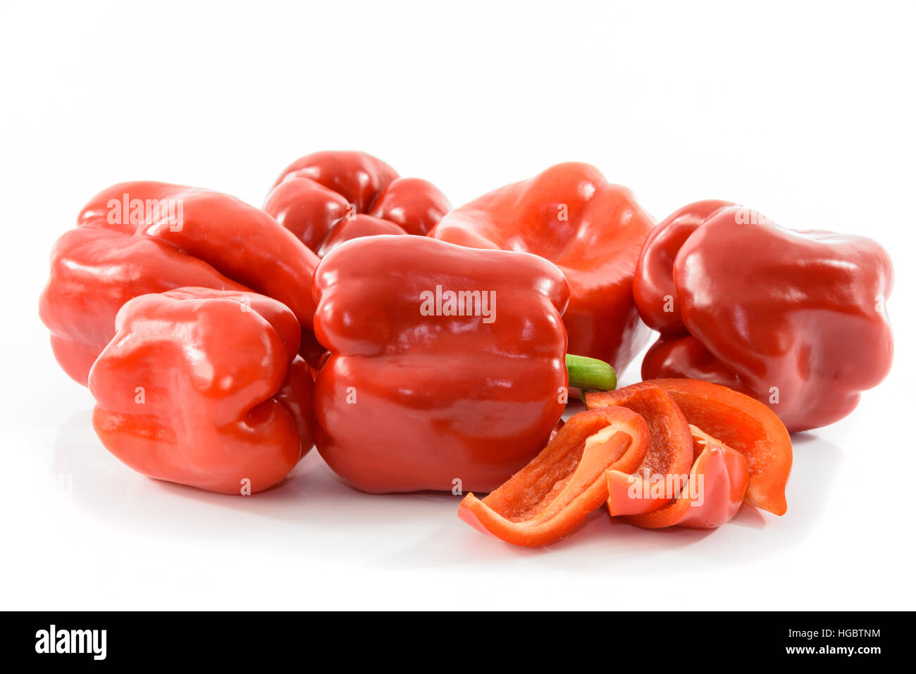 Ripe and fresh red peppers on a white background Stock Photo - Alamy