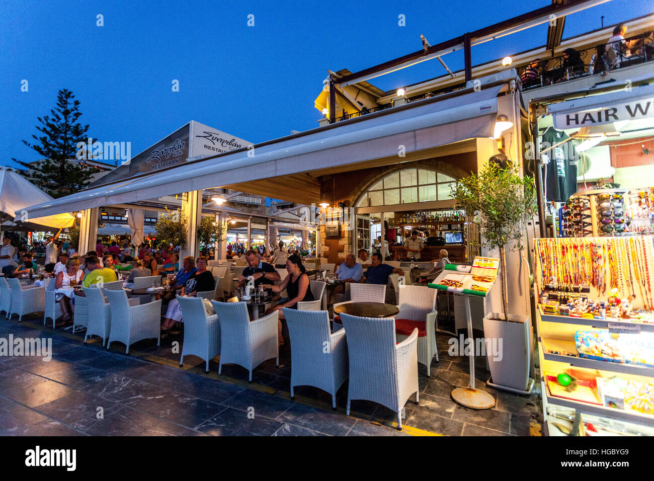 Crete Chania bar, people dining outside, Old Venetian harbour, Chania ...