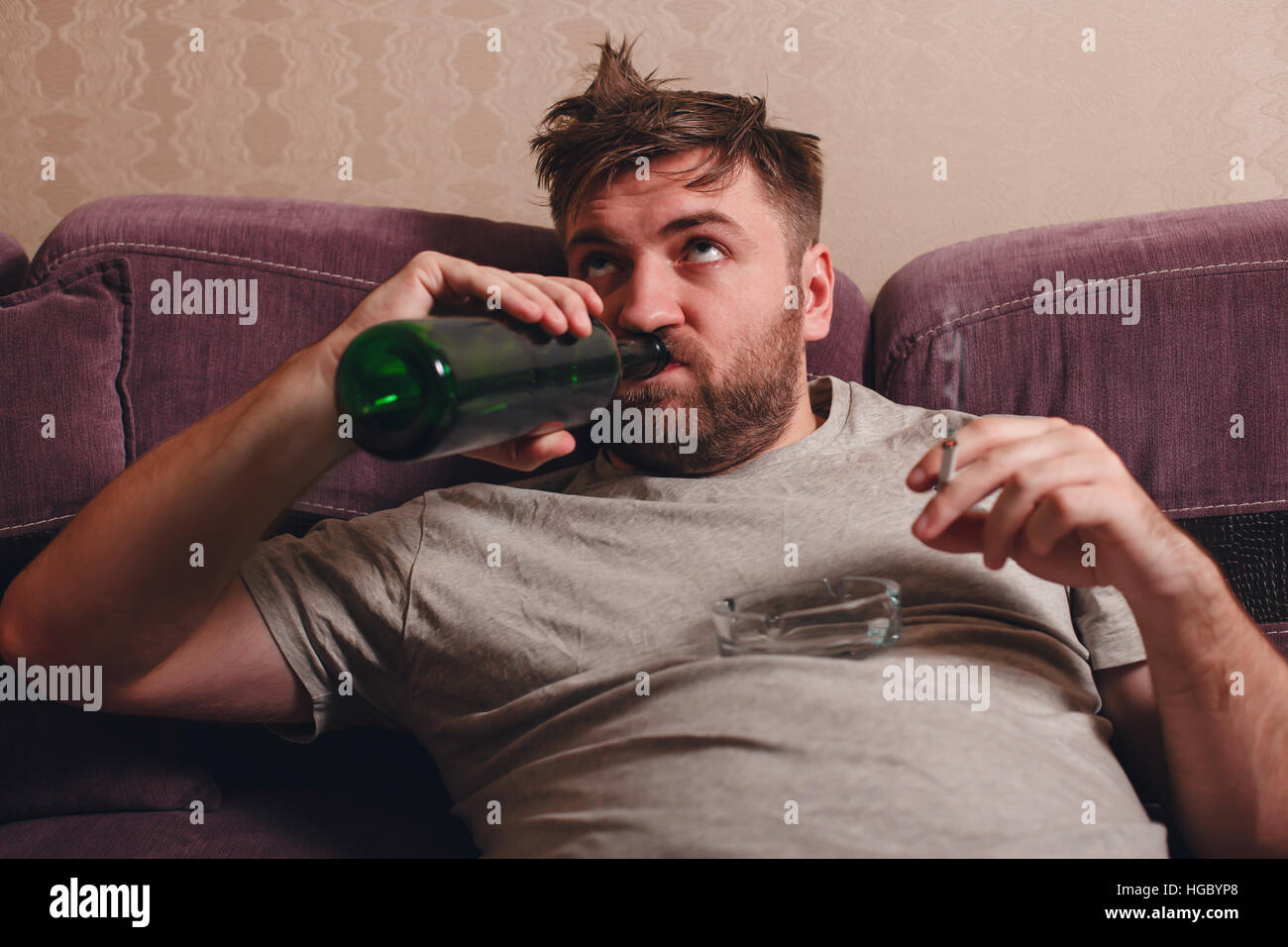 Drunk man drink alcohol. Stock Photo