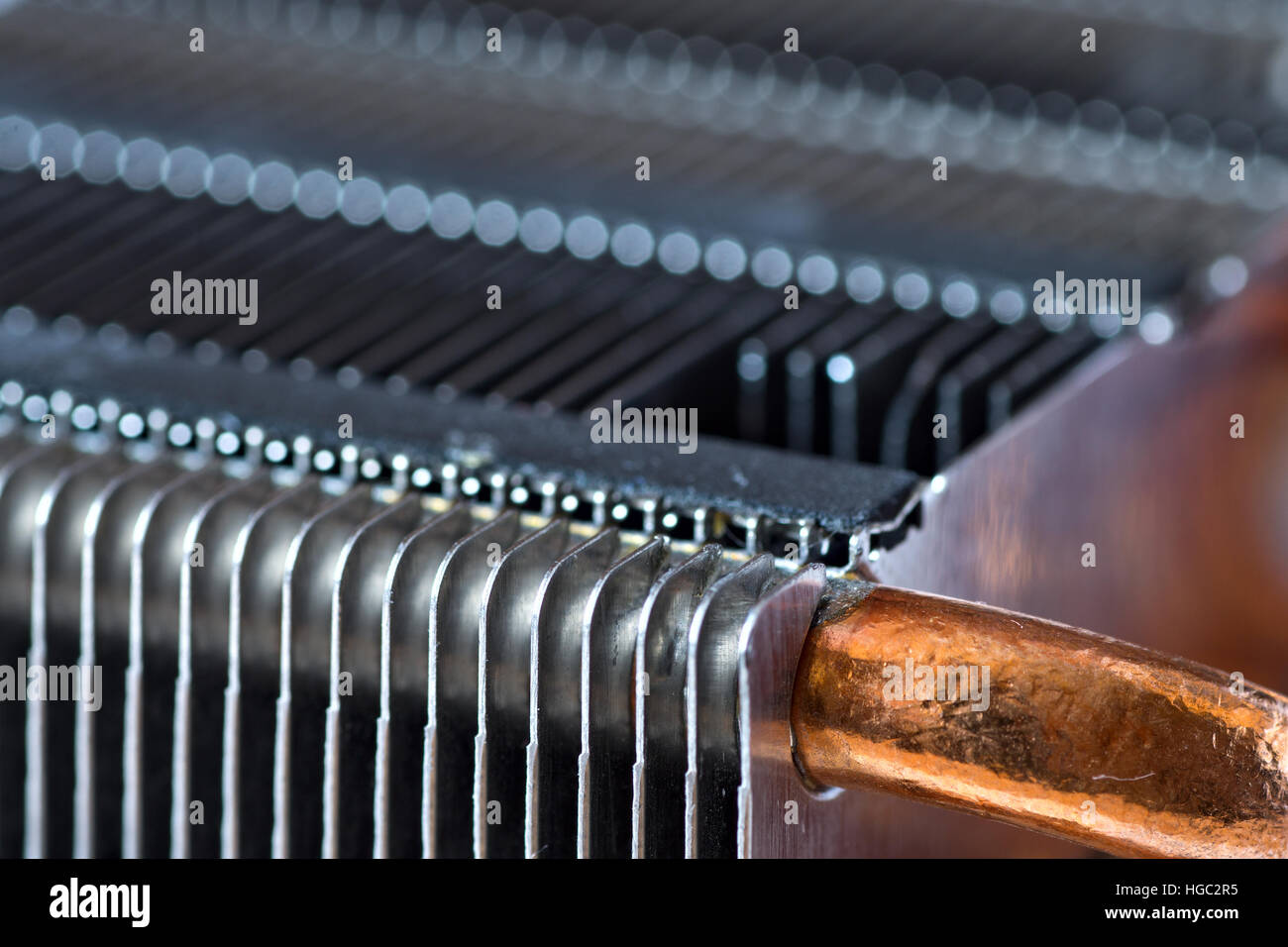 Aluminum radiator with copper heat pipe close-up with beautiful bokeh Stock Photo