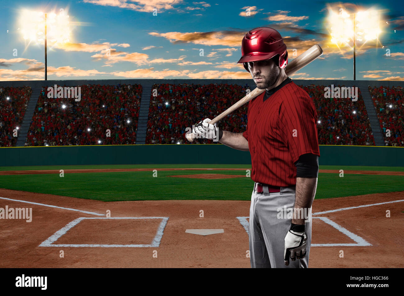 Baseball Player with a red uniform on baseball Stadium Stock Photo - Alamy