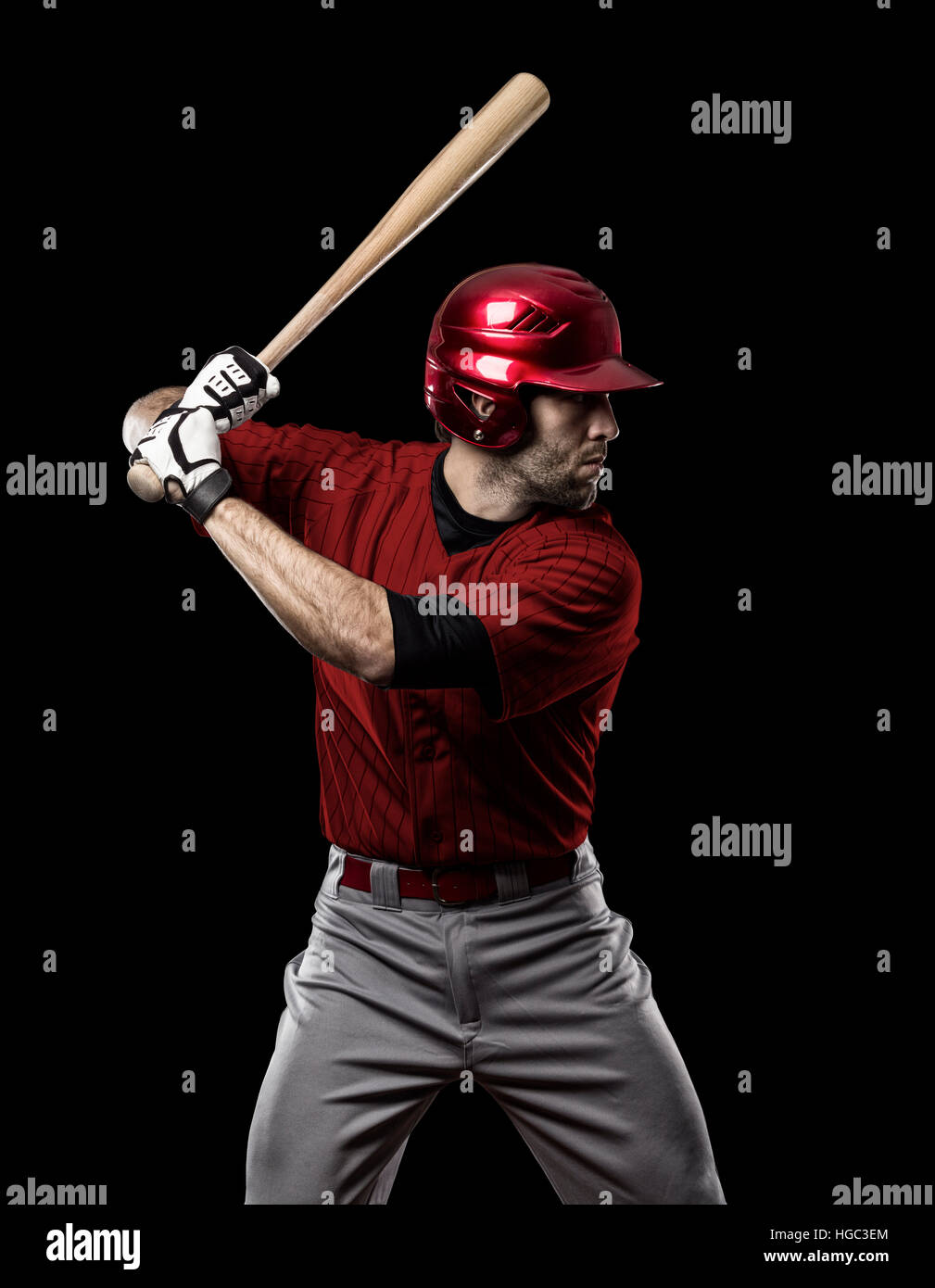 Baseball Player with a red uniform on a black background Stock Photo ...