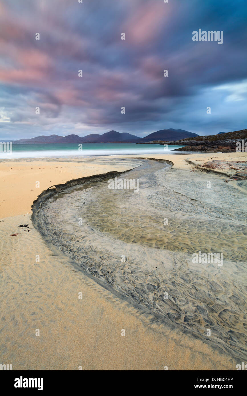 A steam on Luskentyre (Losgaintir)  Beach on the Isle of Harris captured at sunset. Stock Photo