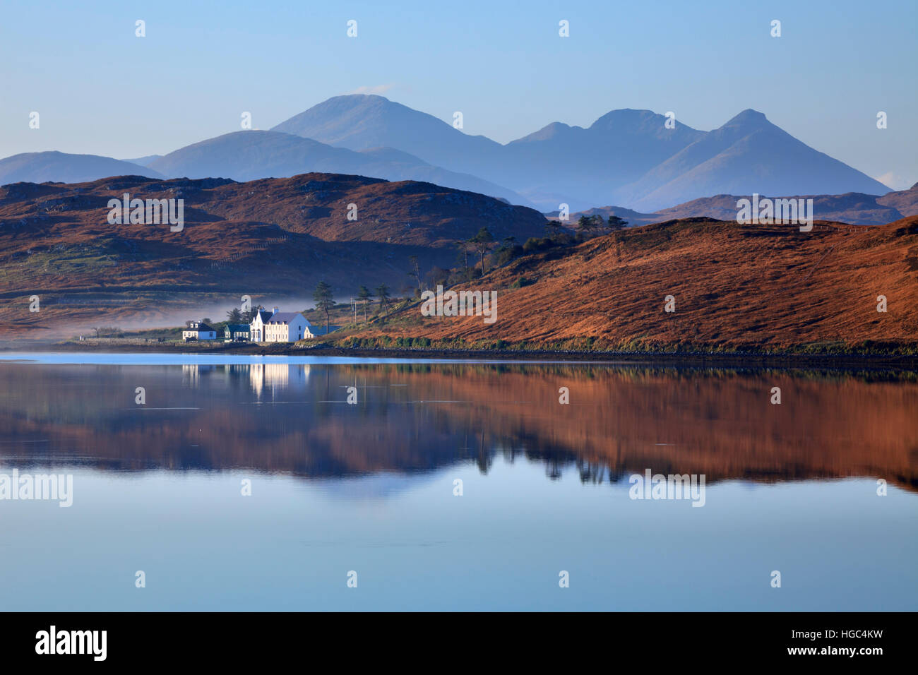 The mountains on North Harris reflected in Loch Ceann Hulabhaig near Callanish on the Isle of Lewis. Stock Photo