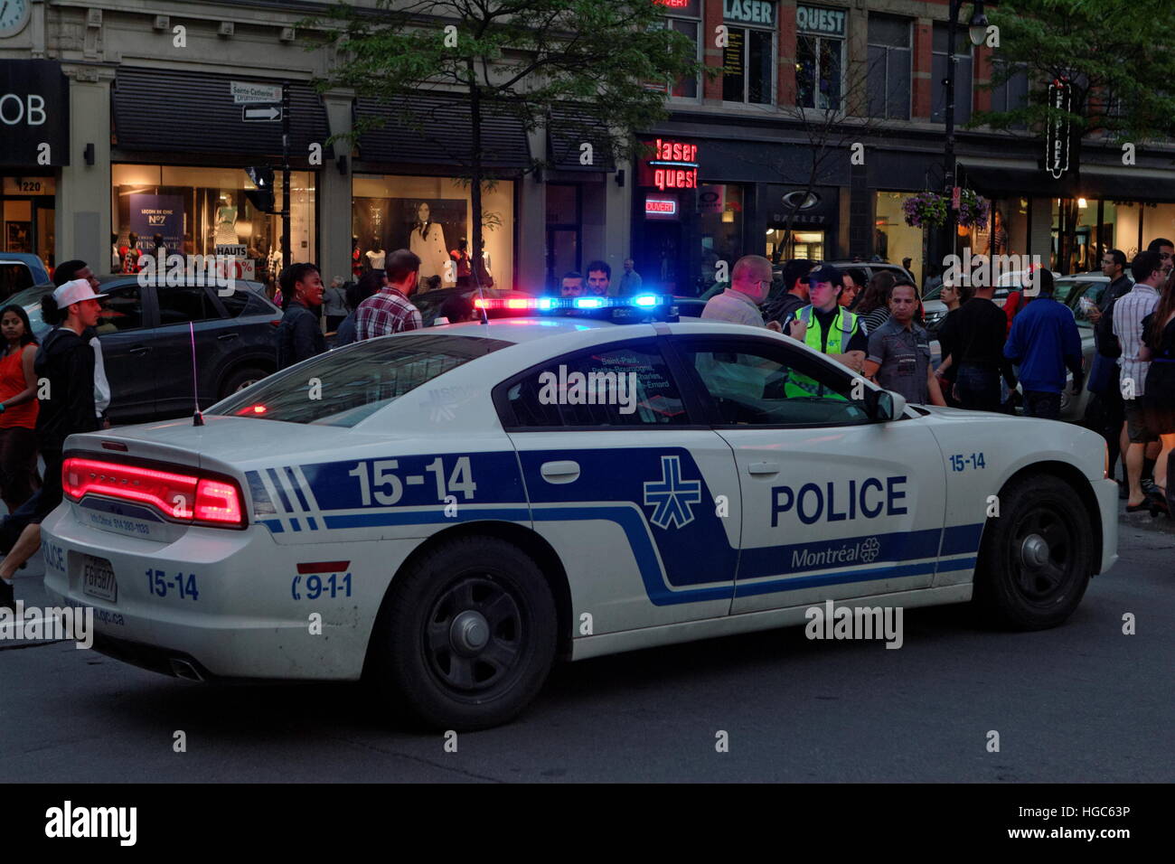A police car parked on Sainte-Catherine street in the heart of downtown Montreal, Quebec Stock Photo
