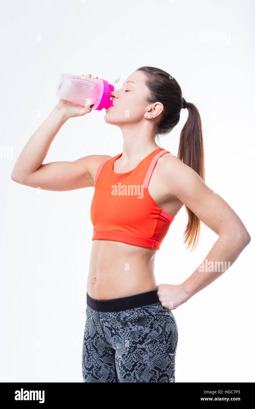 woman drinking lots of water as a part of her daily workout Stock Photo