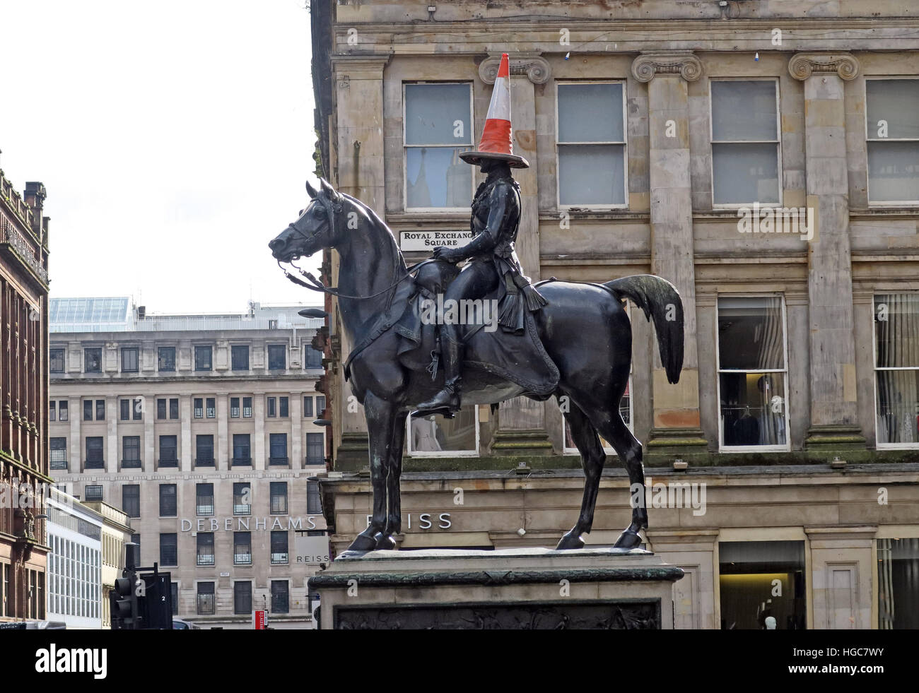 Traffic cone crowns Glasgow’s Duke of Wellington statue in Royal Exchange Square, continuing a decades-old Scottish urban tradition much repeated Stock Photo