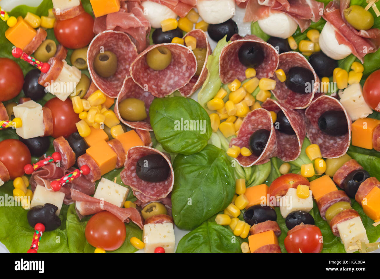 Appetizer platter with salami, olives, tomatoes,corn, cheese Stock