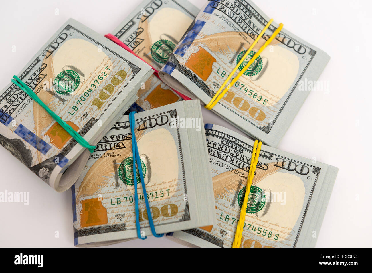 Packs of hundred dollar banknotes with rubber bands Stock Photo Alamy